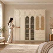 Mossylora Wardrobe with Storage Cabinet with a woman standing beside the cabinet; three lower drawers and upper cupboards.
