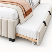 Movcopper Ivory Kids Trundle Bed close-up showing black pull handles, small castors and the upholstered underbed front.