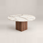 Mushmely Marble Top 4-Seater Dining Table, detailed with a round marble top and grey surface veining against a grey backdrop.
