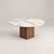 Mushmely Marble Top 4-Seater Dining Table, detailed with a round marble top and grey surface veining against a grey backdrop.