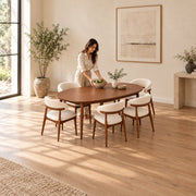 Close-up of Nysoliny Wooden Oval 6-Seater Dining Table, highlighting oval tabletop with a slim edge in a modern home setting.
