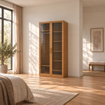 Porteriy 2 Door Wooden Closet Cabinet displays dark door edging together with long slim pulls beside a bedroom window.