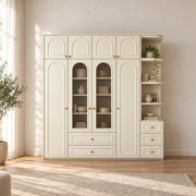 Rakilony 4 Door Wardrobe with Side Shelves in a sunlit bedroom, showing lower storage drawers alongside upper cupboards.