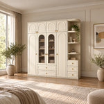 Rakilony 4 Door Wardrobe with Side Shelves, detailed with rounded side shelving and upper cupboards in a sunlit bedroom.