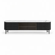 Raveliono White Marble Top TV Unit shown with a white marble top, black fluted side panels and dark glass centre storage.