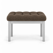 Rebosy Pedicure Footrest combines mocha taupe fabric padding with a slim metal front rail and four straight metal legs.