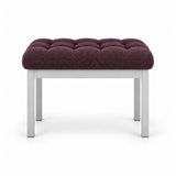 Rebosy Pedicure Footrest upholstered in deep plum brown fabric, with deep button tufting and four straight metal legs.