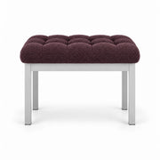 Rebosy Pedicure Footrest upholstered in deep plum brown fabric, with deep button tufting and four straight metal legs.