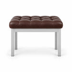 Rebosy Pedicure Footrest with a brown leather top, four straight metal legs and deep button tufting on a white backdrop.
