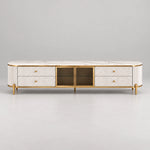 Stillvolra White Marble Top TV Unit: fine gold-tone trim, four fluted drawers and a white marble top against a grey backdrop.