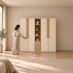 Stylonsy Wooden Wardrobe with Shelves and Drawers with a woman standing beside the cabinet, showing circular door pulls.