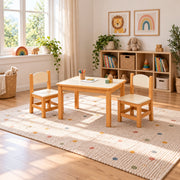 Tischona Kids Table with 2 Chairs combines an ivory inset tabletop with curved-top back panels beside a playroom window.
