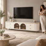 Tostemo White Marble Top TV Unit beside a woman in a sunlit furnished living room, showing twin arched centre doors.
