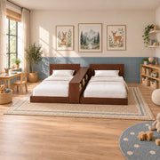 Close-up of Tribekio Wooden Kids Twin Beds with Storage Shelf, highlighting two low-profile beds in a modern home setting.
