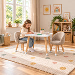 Vevory White Kids Table with 2 Beige Chairs: a white square tabletop beside a child seated at the table on a patterned rug.
