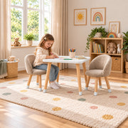 Vevory White Kids Table with 2 Beige Chairs: a white square tabletop beside a child seated at the table on a patterned rug.