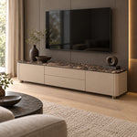 Vicindola Marble Top TV Unit beside living room seating, showing short recessed feet alongside taupe cupboard fronts.