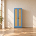 Webinora Blue 2 Door Wooden Cane Wardrobe brings together two blue doors and a narrow cabinet body against a bedroom wall.