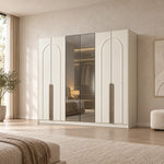 Weltwiyo 6 Door Wooden Wardrobe combines reflective central panels with slender arch detailing beside a bedroom window.