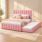 Werlisori Pink Kids Trundle Bed against a bedroom wall, showing wide padded channels alongside an extended side trundle.
