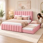 Werlisori Pink Kids Trundle Bed with bedding being arranged on the trundle; wide padded channels and coordinated upholstery.