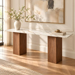 Yorkosta marble-top hallway console with light veining contrasted against warm brown block bases in a modern interior.