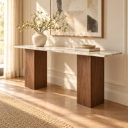 Close view of the Yorkosta console table showing pale marble-look veining, smooth edges, and sturdy brown supports.